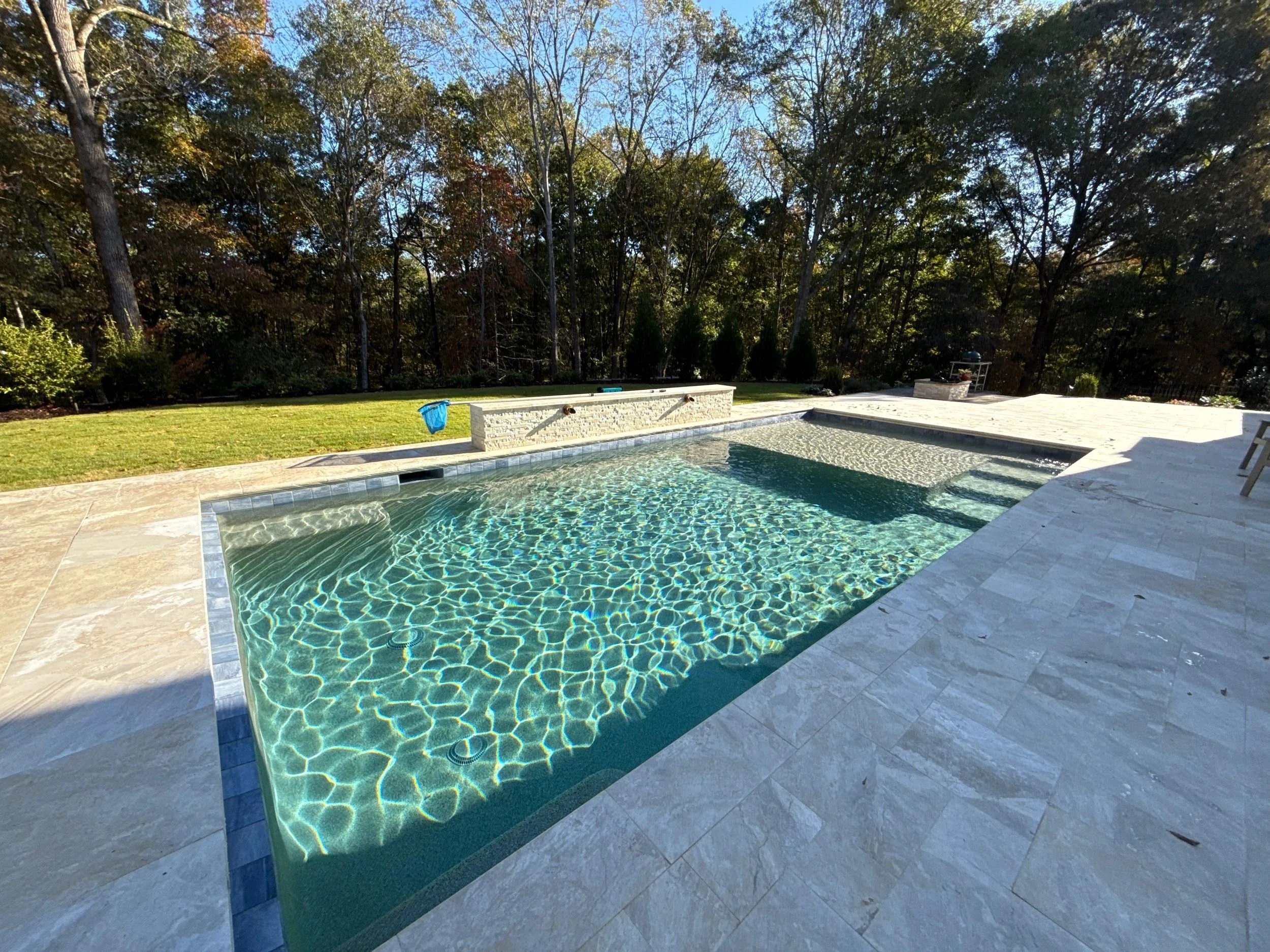 Sunlight reflecting through an Outdoor Oasis pool